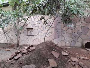 سنگ کاری نما دیوار باغ با سنگ لاشه